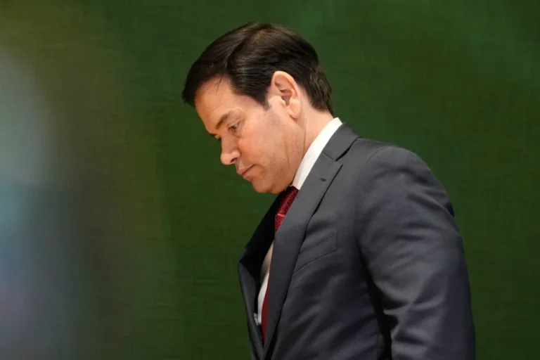 (United States Secretary of State Marco Rubio walks down stairs after a meeting during the Annual Meeting of the World Economic Forum in Davos, Switzerland, Wednesday, Jan. 21, 2026.  AP Photo: Markus Schreiber)