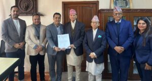 NRNA-Minister Sharma