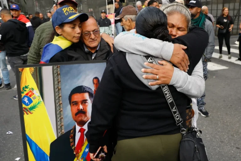 (Supporters of Venezuelan President Nicolás Maduro embrace in downtown Caracas, Venezuela, Saturday, Jan. 3, 2026, after U.S. President Donald Trump announced that Maduro had been captured and flown out of the country.  AP Photo: Cristian Hernandez)