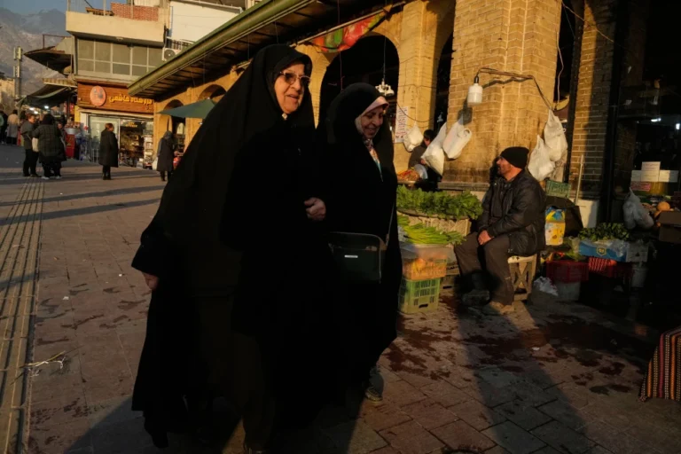 Women walk Tajrish Bazar, Iran