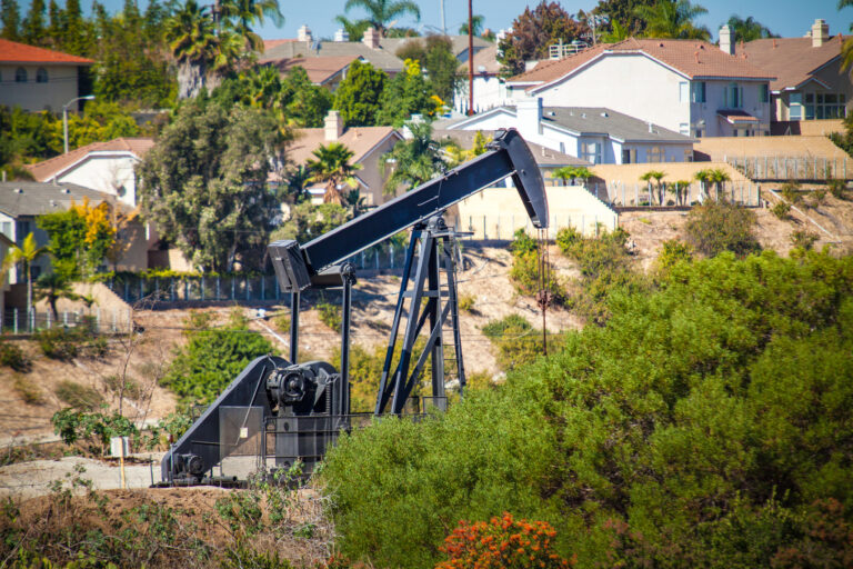 An oil pumpjack near homes in the Inglewood Oil Field, Los Angeles, California.
