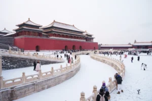 (Tourists visit a snow-covered Forbidden City in Beijing, China, Sunday, Jan. 18, 2026.  AP Photo: Vincent Thian)