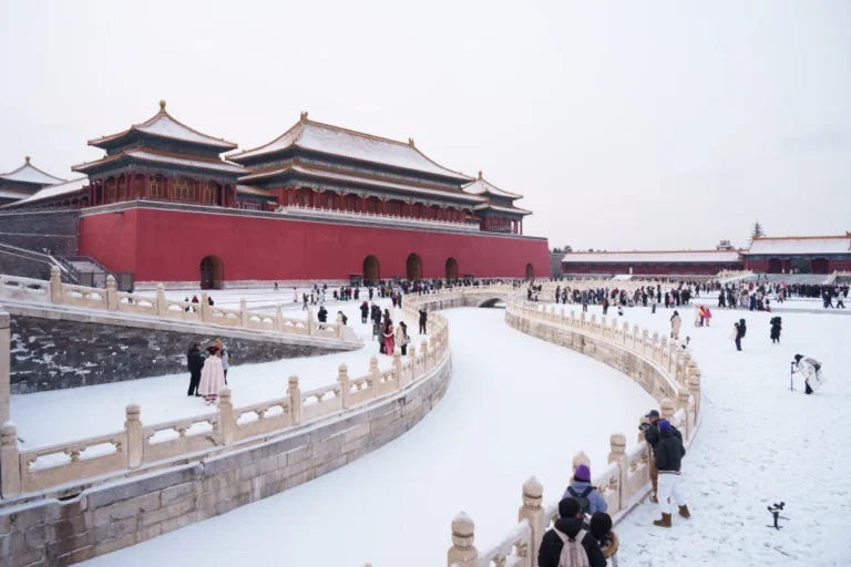 (Tourists visit a snow-covered Forbidden City in Beijing, China, Sunday, Jan. 18, 2026.  AP Photo: Vincent Thian)
