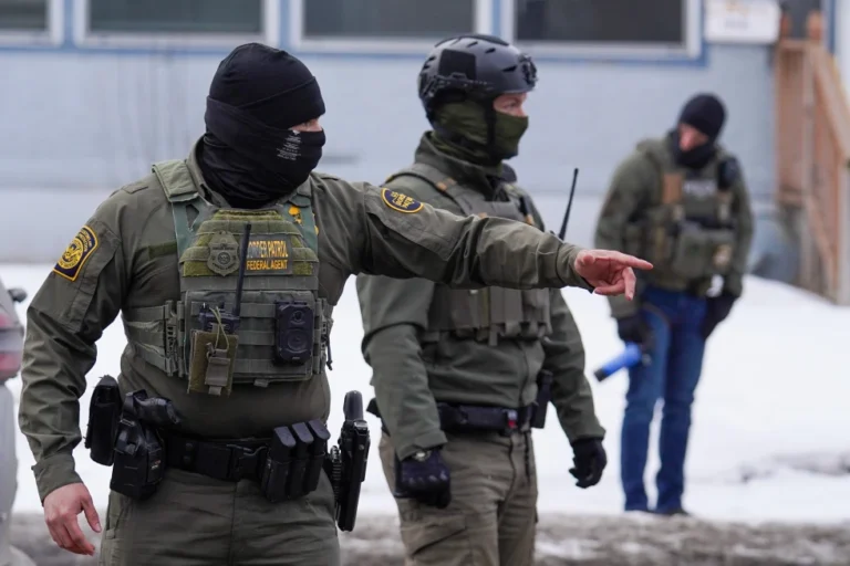 (A United States Border Patrol agent gestures to a car while conducting immigration enforcement operations, Thursday, Feb. 5, 2026, in Minneapolis.  AP Photo: Ryan Murphy)