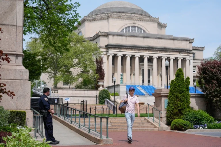 (A New York City police officer keeps watch on the campus of Columbia University in New York, May 6, 2024.  AP Photo: Seth Wenig, File)