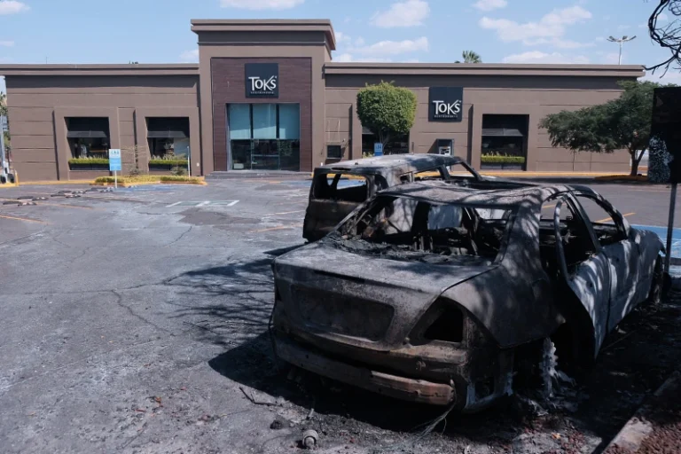 (Charred vehicles sit in a parking lot outside a shopping mall in Guadalajara, Jalisco state, Mexico, Sunday, Feb. 22, 2026, as authorities reported that the Mexican Army killed Jalisco New Generation Cartel leader Nemesio Oseguera Cervantes, known as “El Mencho.”  AP Photo: Alejandra Leyva)