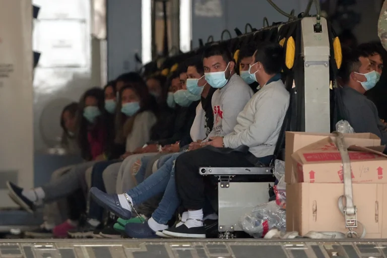 Migrants wearing face masks