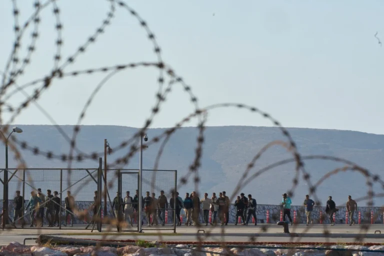 (Migrants rescued south of Crete walk after their arrival at the the port of Lavrio, Greece, on Thursday, July 10, 2025. AP Photo: Petros Giannakouris)