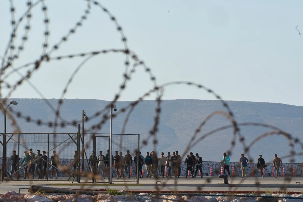 (Migrants rescued south of Crete walk after their arrival at the the port of Lavrio, Greece, on Thursday, July 10, 2025. AP Photo: Petros Giannakouris)
