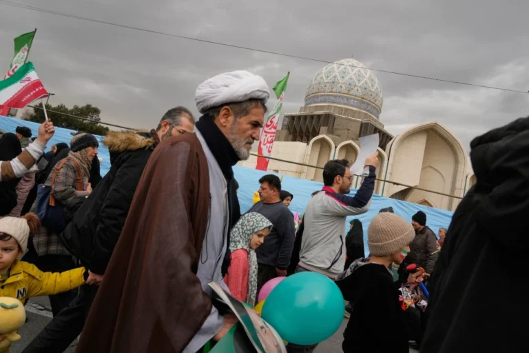 (A cleric and other people attend an annual rally marking 1979 Islamic Revolution in Tehran, Iran, Wednesday, Feb. 11, 2026.  AP Photo: Vahid Salemi)