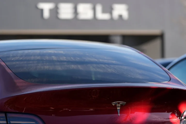 (A Tesla model Y and other Telsla vehicles sit at a dealership, Wednesday, March 19, 2025, in Kennesaw, Ga.  AP Photo: Mike Stewart, File)