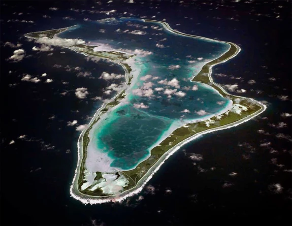 (This image released by the U.S. Navy shows an aerial view of Diego Garcia in the Chagos Island group.  Photo: U.S. Navy)