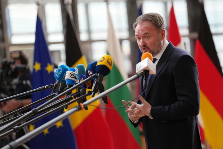 (European Commissioner for Energy and Housing Dan Jorgensen speaks with the media as he arrives for a meeting of EU energy ministers at the European Council building in Brussels, Monday, March 16, 2026.  AP Photo: Virginia Mayo)