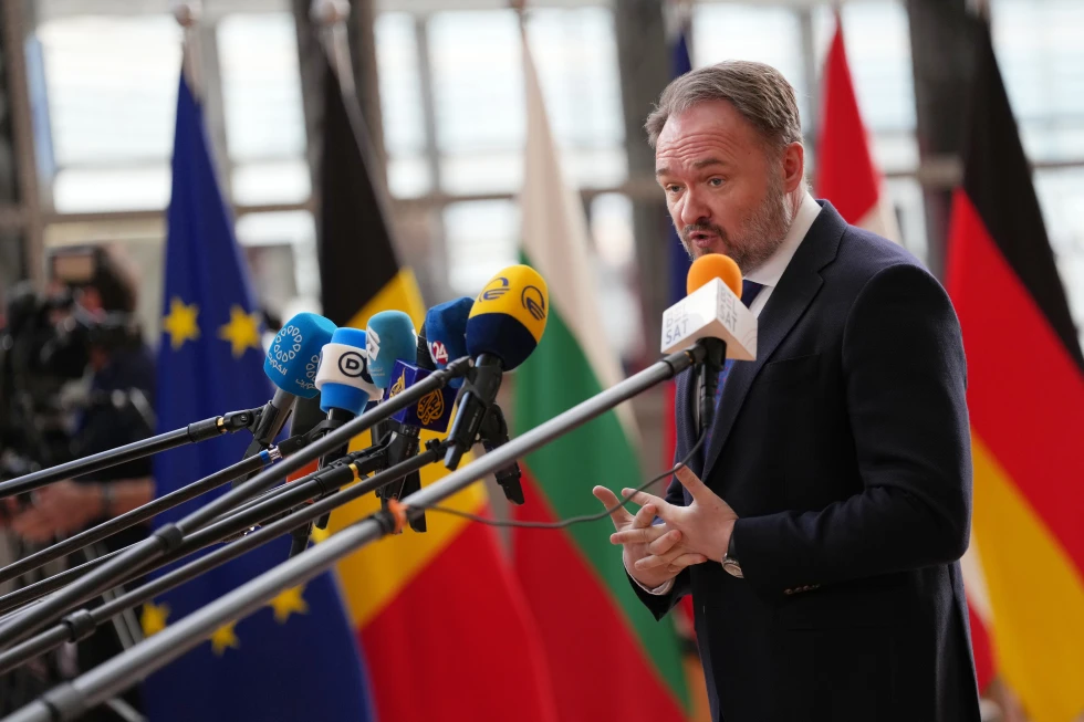 (European Commissioner for Energy and Housing Dan Jorgensen speaks with the media as he arrives for a meeting of EU energy ministers at the European Council building in Brussels, Monday, March 16, 2026.  AP Photo: Virginia Mayo)