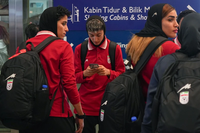 (Members of Iran’s women’s football team arrive at the Kuala Lumpur International Airport in Sepang, Malaysia, Monday, March 16, 2026. AP Photo: Azneal Ishak)