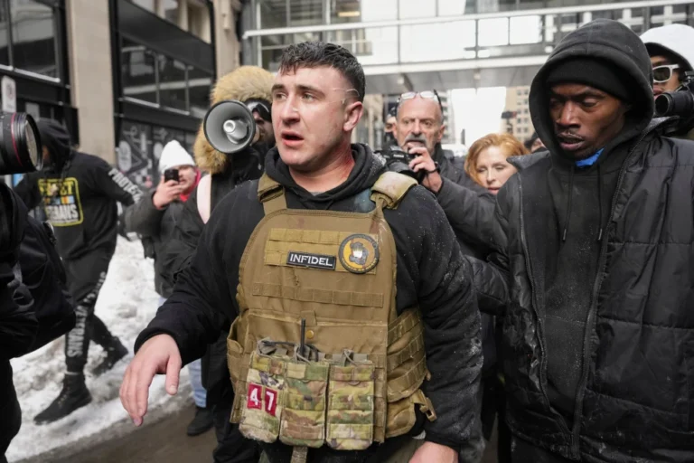 (Jake Lang, center, walks away from counter protesters after an altercation near Minneapolis City Hall, Saturday, Jan. 17, 2026, in Minneapolis. AP Photo: Yuki Iwamura,File)