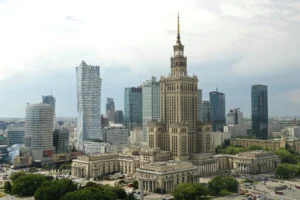 (Newer skyscrapers flank the communist-era Palace of Culture and Science, foreground, in n, Poland, May 25, 2018. AP Photo: Alik Keplicz, File)