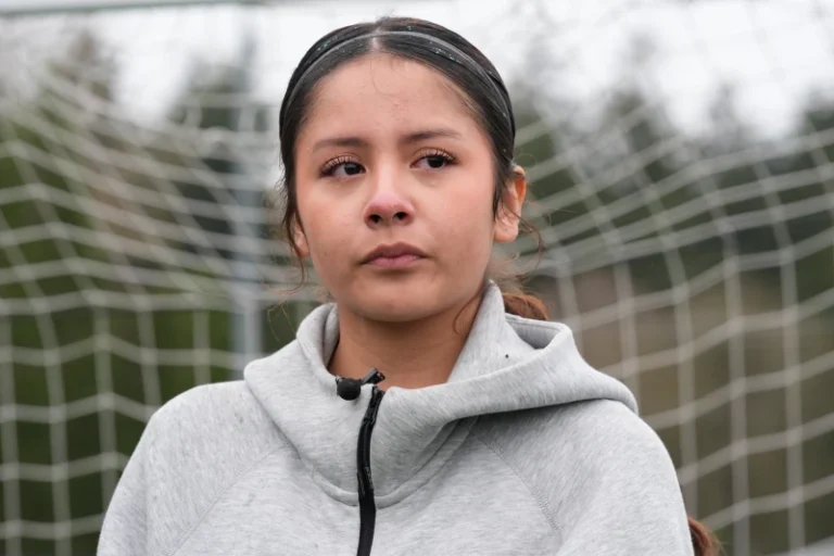 (Valeria Hernandez tears up during an interview at a soccer tournament for immigrant and refugee girls on Sunday, March 29, 2026, in Portland, Ore.  AP Photo: Jenny Kane)