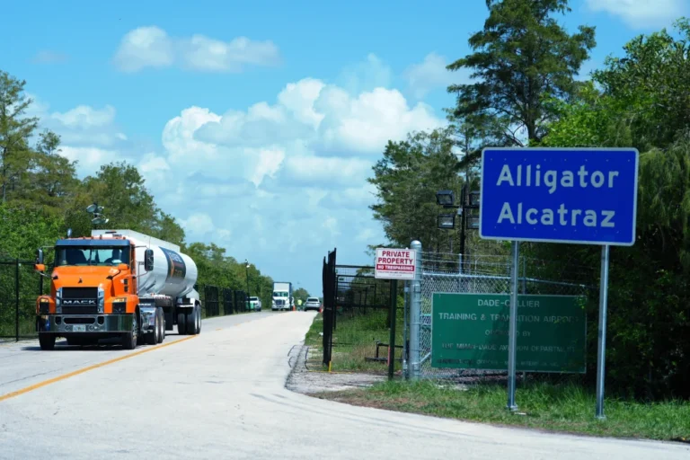 (Trucks come and go from the “Alligator Alcatraz” immigration detention center in the Florida Everglades, Thursday, Aug. 28, 2025, in Collier County, Fla. AP File Photo: Rebecca Blackwell)