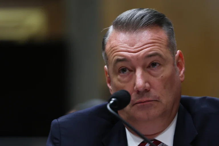 (Todd Lyons, senior official performing the duties of the director at U.S. Immigration and Customs Enforcement, listens during a Senate Homeland Committee hearing on Capitol Hill in Washington, Feb. 12, 2026. AP Photo: Tom Brenner, File)