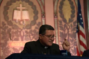 (Auxiliary Bishop Evelio Menjivar-Ayala speaks on a panel about immigration at Georgetown University in Washington, Thursday, Sept. 11, 2025. (AP Photo/Luis Andres Henao)