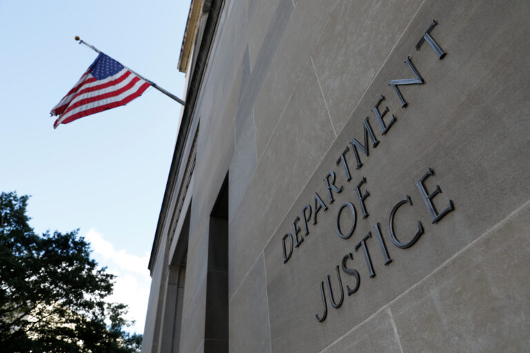Signage is seen at the United States Department of Justice headquarters in Washington, D.C., U.S., August 29, 2020. REUTERS/Andrew Kelly