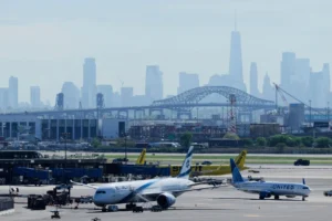 (The New York City skyline is seen behind Newark Liberty International Airport in Newark, N.J., Wednesday, May 7, 2025. (AP Photo: Seth Wenig,File)