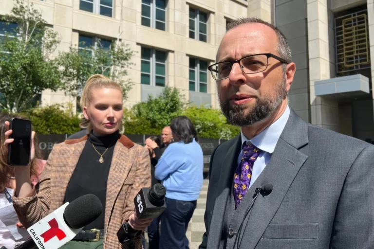 (Patrick Kolasinski, an immigration attorney representing Carlos Ivan Mendoza Hernandez, a man shot during an arrest by U.S. Immigration and Customs Enforcement, talks to reporters Tuesday, April 14, 2026, in Sacramento, Calif.  AP Photo: Sophie Austin)