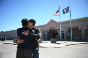 (Roberto Orozco-Ramirez Jr and Sr. embrace outside of the Cascade County Sheriff’s after being released, Thursday, May 14, 2026, in Great Falls, Mont. (Lauren Miller, Montana Free Press, CatchLight Local/Report for America via AP)