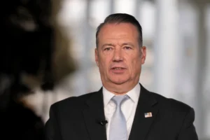 (Todd Lyons, acting director of the U.S. Immigration and Customs. Enforcement (ICE), speaks during a television interview the White House Nov. 3, 2025 in Washington. (AP Photo/Manuel Balce Ceneta, File)