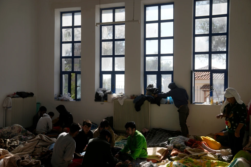 (Migrants, most of them from Afghanistan, rest at an old school used as a temporary shelter on the island of Kythira, southern Greece, Oct. 7, 2022. AP Photo: Thanassis Stavrakis, File)