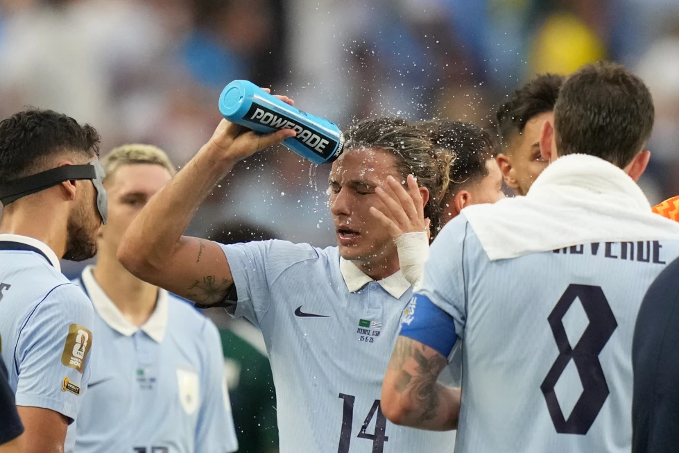 (Uruguay’s Agustin Canobbio cools off during a hydration break in a World Cup Group H soccer match against Saudi Arabia in Miami Gardens, Fla., Monday, June 15, 2026. AP Photo: Lynne Sladky)