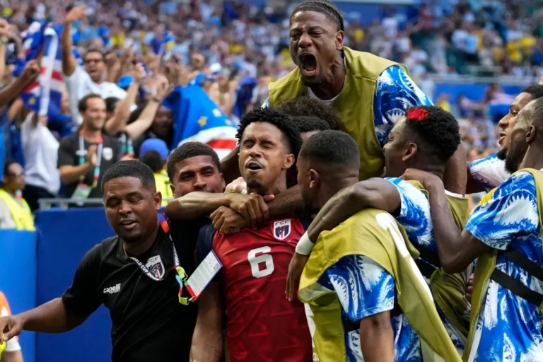 (Cape Verde's Kevin Pina, center, celebrates with teammates after scoring the opening goal during the World Cup Group H soccer match between Uruguay and Cape Verde in Miami Gardens, Fla., Sunday, June 21, 2026. AP Photo: Lynne Sladky)