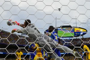 (Curaçao goalkeeper Eloy Room (1) makes a save during the World Cup Group E soccer match between Ecuador and Curacao in Kansas City, Mo., Saturday, June 20, 2026. AP Photo: Ed Zurga)