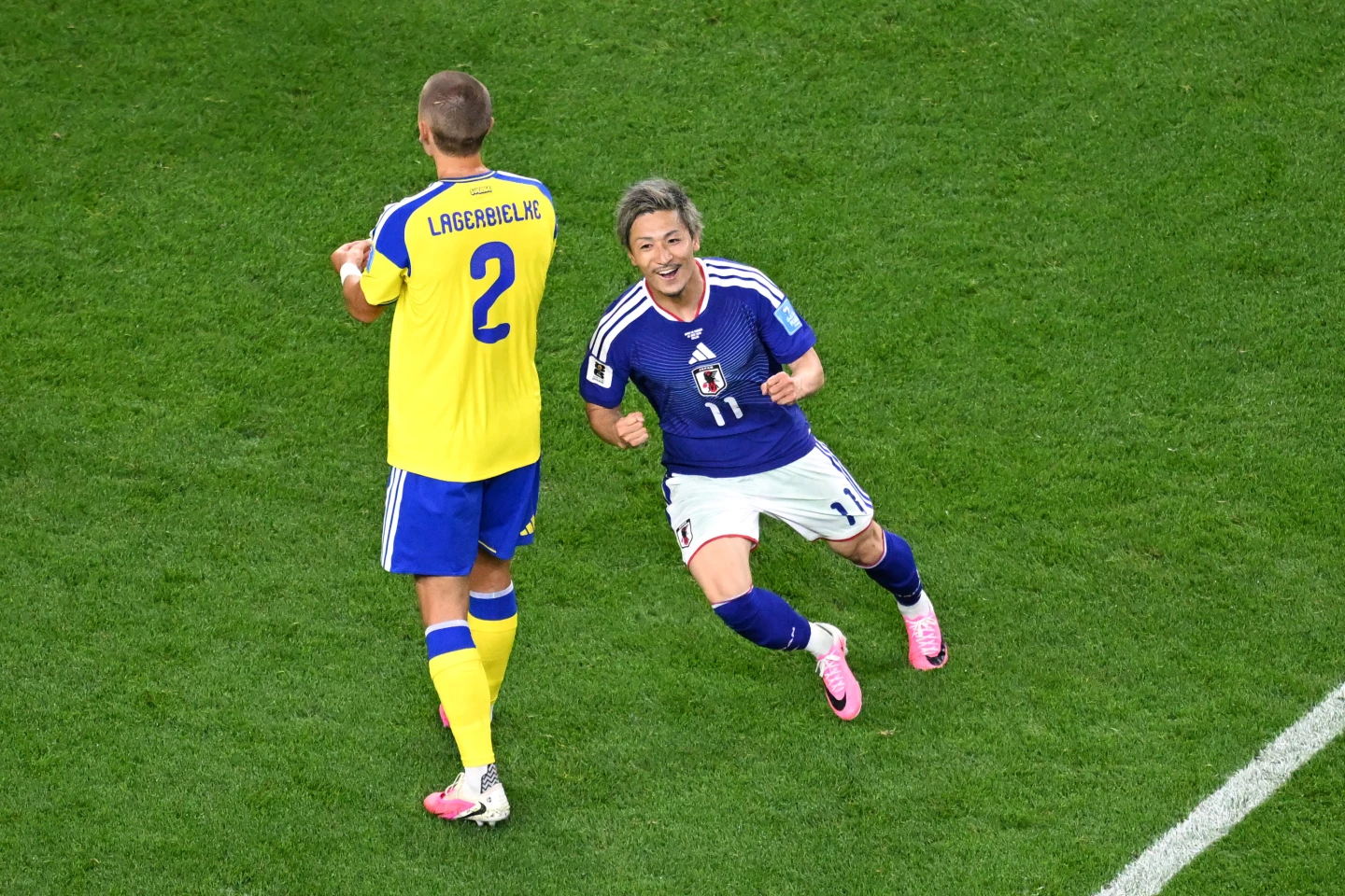 (Japan's Daizen Maeda, right, celebrates after scoring their opening goal during the World Cup Group F soccer match between Japan and Sweden in Arlington, Texas, near Dallas, Thursday, June 25, 2026.  AP Photo: Jessica Tobias)
