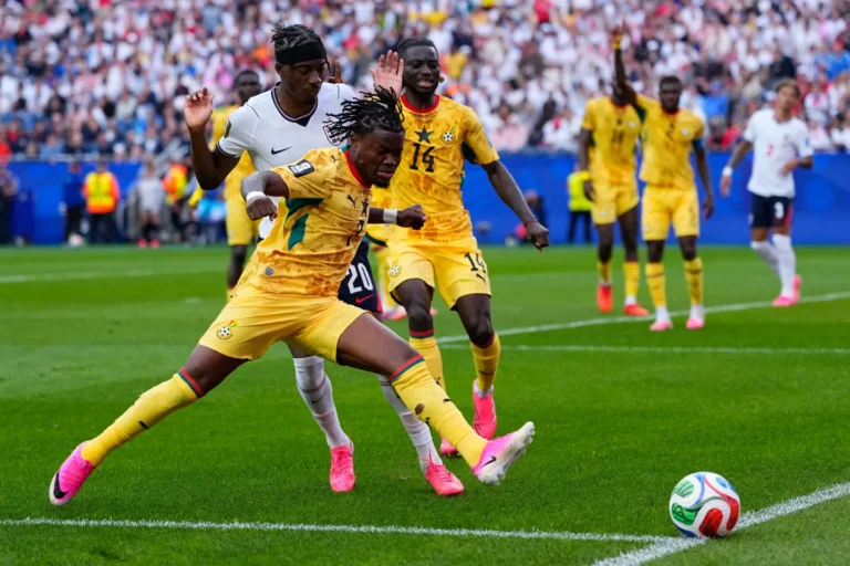 (Ghana’s Fatawu Issahaku (7) and England’s Noni Madueke (20) battle for the ball during the World Cup Group L soccer match between England and Ghana in Foxborough, Mass., near Boston, Tuesday, June 23, 2026.  AP Photo: Petr David Josek)