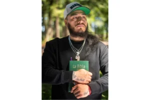 (Gabriel Martinez Garcia, 30, holds a Bible close to his chest as tattoos of his parents are visible on his wrists, in Tenino, Wash., on Sunday, June 14, 2026. AP Photo: Akash Pamarthy)