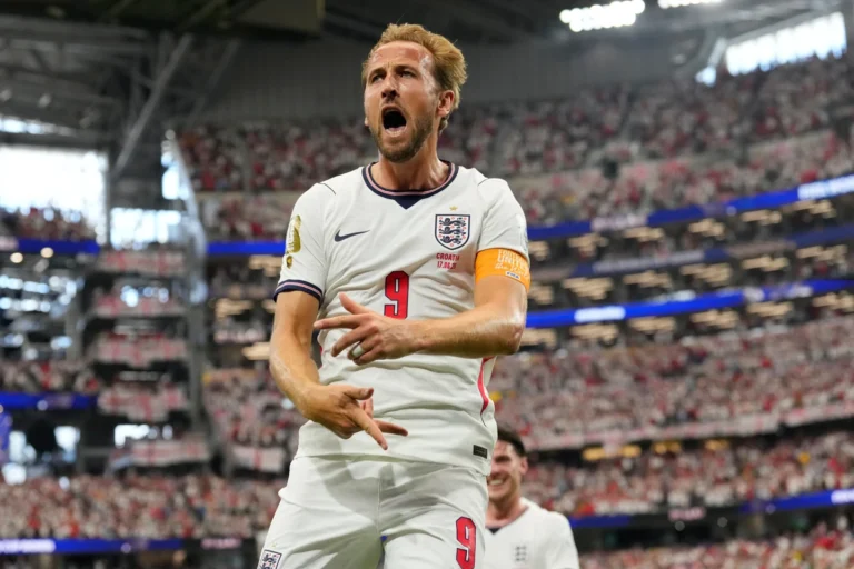 (England's Harry Kane (9) celebrates after scoring a goal during the World Cup Group L soccer match between England and Croatia in Arlington, Texas, near Dallas, Wednesday, June 17, 2026.  AP Photo: Tony Gutierrez)