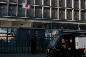 (A delivery man drives past the Japanese Embassy in Beijing on Nov. 24, 2025.  AP Photo: Ng Han Guan)
