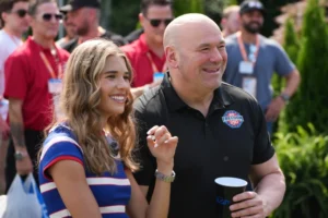 (Kai Trump, left, and UFC President and CEO Dana White looks on before a Motorsports athlete and stunt performer does a motorcycle jump ahead of the UFC Freedom 250 fights on the South Lawn of the White House, Saturday, June 13, 2026, in Washington.  AP Photo: Alex Brandon, Pool)