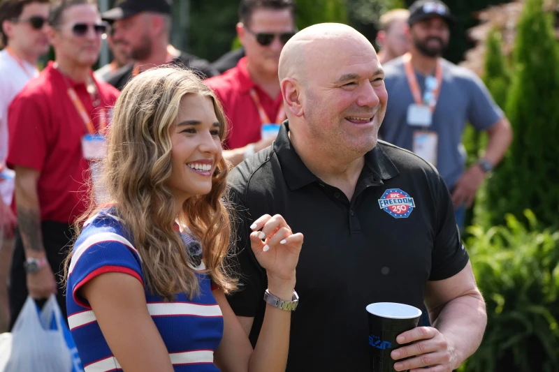 (Kai Trump, left, and UFC President and CEO Dana White looks on before a Motorsports athlete and stunt performer does a motorcycle jump ahead of the UFC Freedom 250 fights on the South Lawn of the White House, Saturday, June 13, 2026, in Washington.  AP Photo: Alex Brandon, Pool)
