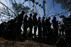 (Malawian migrants stand in a queue for their deportation at a temporary centre, in Durban, South Africa, Thursday, June 18, 2026.  AP Photo: Themba Hadebe)