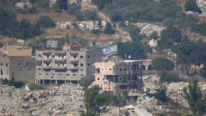 (An Israeli flag tops a destroyed building in southern Lebanon, as seen from northern Israel, Sunday, June 28, 2026. AP Photo: Ohad Zwigenberg)