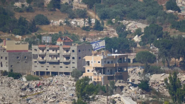 (An Israeli flag tops a destroyed building in southern Lebanon, as seen from northern Israel, Sunday, June 28, 2026. AP Photo: Ohad Zwigenberg)