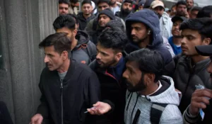 (A crowd of Pakistanis gathers at the entrance of the Pakistani consulate in Barcelona, Spain, Thursday, Jan. 29, 2026, following the Spanish government’s decision to grant residency and work permits to potentially hundreds of thousands of immigrants.  AP File Photo: Emilio Morenatti)
