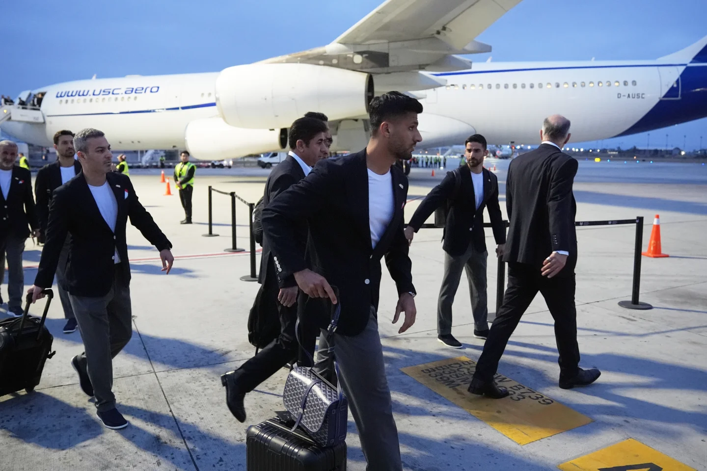 (Players for Iran arrive for the World Cup soccer tournament in Tijuana, Mexico, Sunday, June 7, 2026.  AP Photo: Gregory Bull)