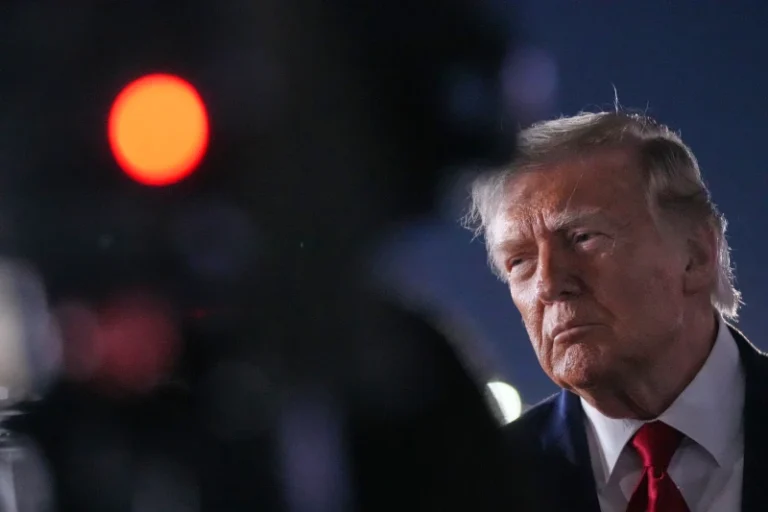 (President Donald Trump talks with reporters before boarding Air Force One at John F. Kennedy International Airport in New York, early Tuesday, June 9, 2026.  AP Photo: Mark Schiefelbein)