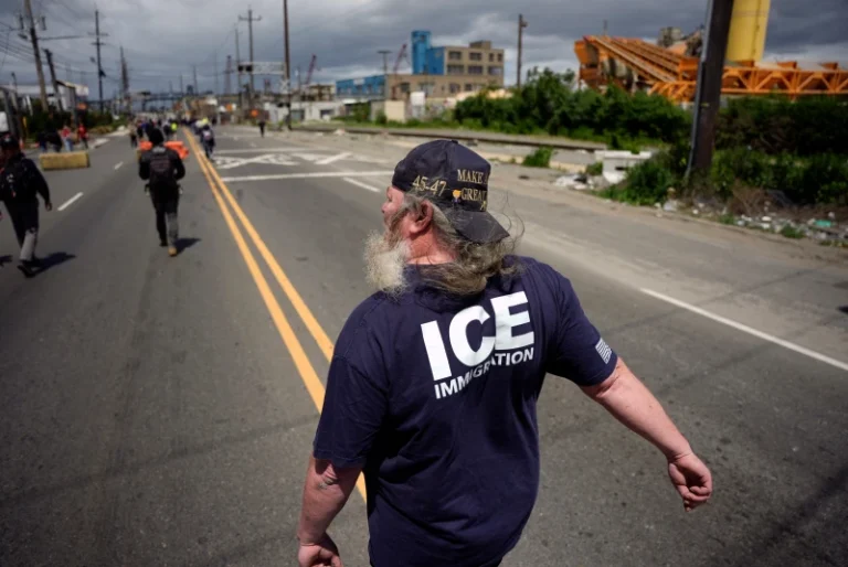(A protester supporting Immigration and Customs Enforcement agents walks on the road outside the Delaney Hall detention center on Saturday, May 30, 2026, in Newark, N.J.  AP Photo: Angelina Katsanis)
