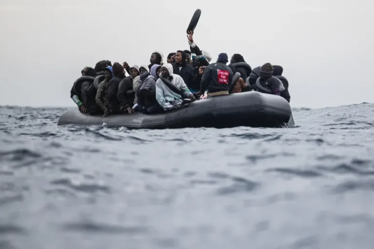 (Migrants onboard a rubber boat wave and gesture as they wait to be rescued by crew members of the Ocean Viking rescue ship in the search-and-rescue zone in the Mediterranean Sea near the Libyan coast, on January 16, 2026. Photo: AFP)