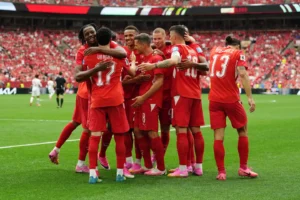 (Switzerland’s Ruben Vargas (17) is mobbed by teammates after scoring their first goal during the World Cup Group B soccer match between Switzerland and Canada in Vancouver, British Columbia, Wednesday, June 24, 2026.  Photo: Ethan Cairns-The Canadian Press)